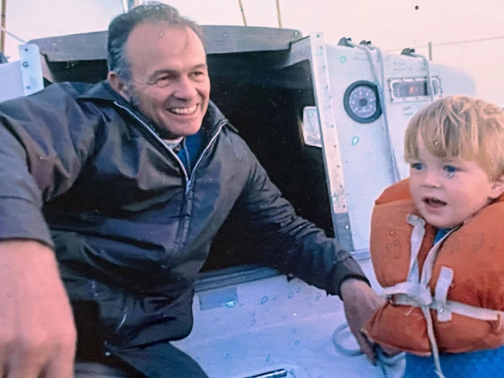 Older man and young boy wearing a life jacket